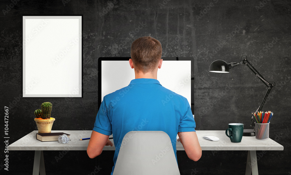 Poster man work on office computer with isolated screen for mockup. modern office interior with isolated po