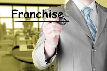 business man writing franchise