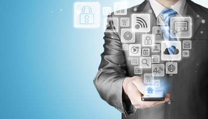 Business man using smart phone with social media icon set