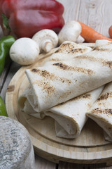 Obraz na płótnie Canvas tortilla wraps with meat and vegetables