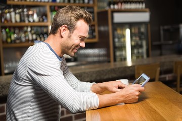 Fototapeta premium Handsome man using tablet computer
