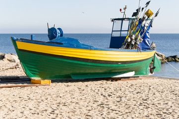 Naklejka na ściany i meble Fishing boat on the coast at Gdynia Orlowo at Baltic sea, Poland