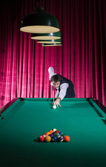 Start the game. An athlete breaks the balls.