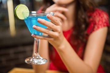 Pretty woman having a cocktail