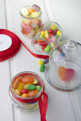 Multicolor candies in glass jars