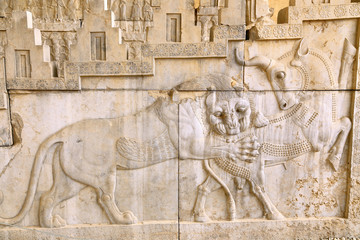 Bas-relief in Persepolis—a symbol in Zoroastrian for Nowruz— eternally fighting bull (personifying the moon), and a lion (personifying the Sun) representing the Spring