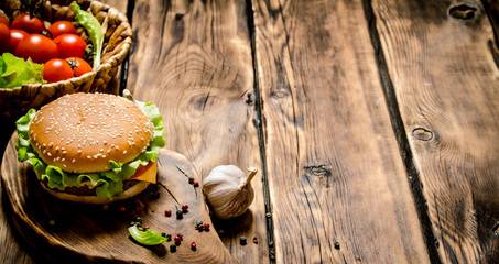 Fresh hamburger with vegetables, meat and spices.