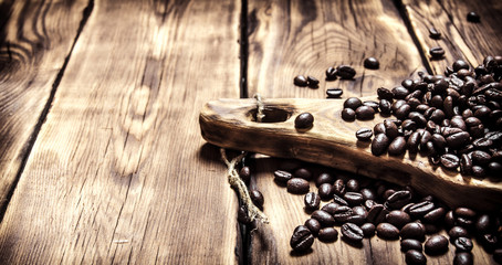 Fresh aromatic coffee beans on a wooden Board.