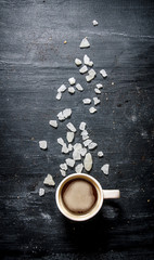 Freshly brewed coffee with crystalline sugar.