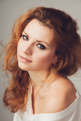 Fototapeta premium Tender beautiful woman in white shirt