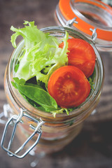 salad in jar on wood