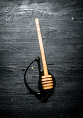 Wooden spoon of sweet natural honey.