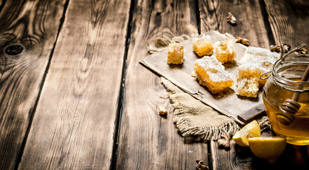 Honey background. Natural honey lemon slices and walnuts.