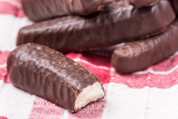 Bunch of chocolate bananas on the kitchen tablecloth