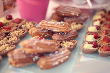 tarts and mini eclairs in a candy bar