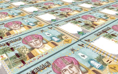 Omani rials bills stacked background. Computer generated 3D photo rendering.