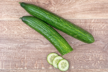 Cucumbers on a wooden background