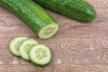 Cucumbers on a wooden background