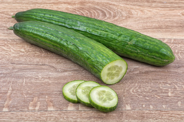 Cucumbers on a wooden background