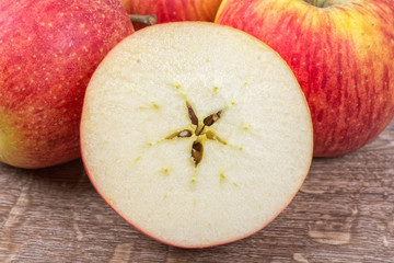 Ripe apples on a wooden background