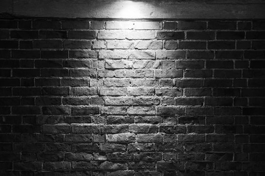 Grungy Dark Brick Wall With Spotlight