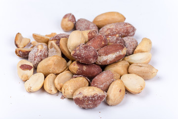 Bunch of roasted peanuts on the white background