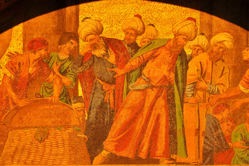 Ancient golden mosaic showing the translation of St Mark, Venice