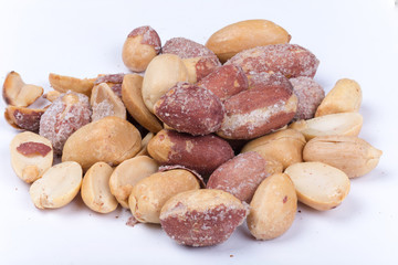Bunch of roasted peanuts on the white background