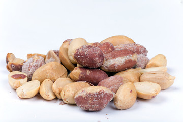 Bunch of roasted peanuts on the white background