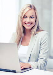 businesswoman with laptop in office