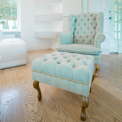 Blue royal style chair with footstool
