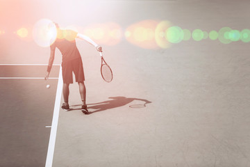 Young male tennis player at the tennis court