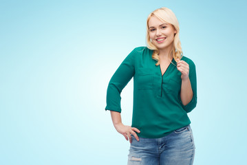 smiling young woman in shirt and jeans