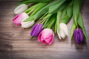 bouquet of tulips on wood