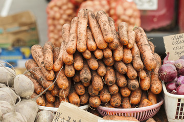 bunch of carrots for sale at a street market