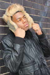 Handsome mixed african race man dressed with smart and casual clothes posing outdoor in Birmingham...