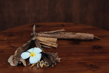 Fototapeta premium Bunch of cinnamon sticks on wooden table