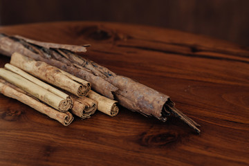 Bunch of cinnamon sticks on wooden table