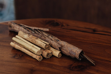 Bunch of cinnamon sticks on wooden table