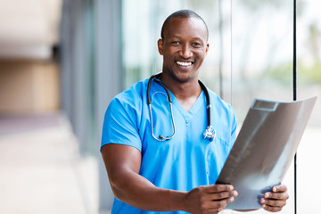 african medical doctor holding CT scan