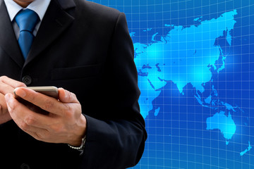 Businessman using smartphone for global business