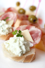 Appetizer with ham, cheese and olives
