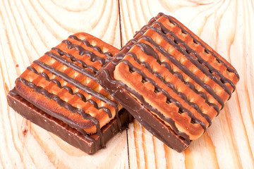 zephyr cookie with chocolate on wooden background
