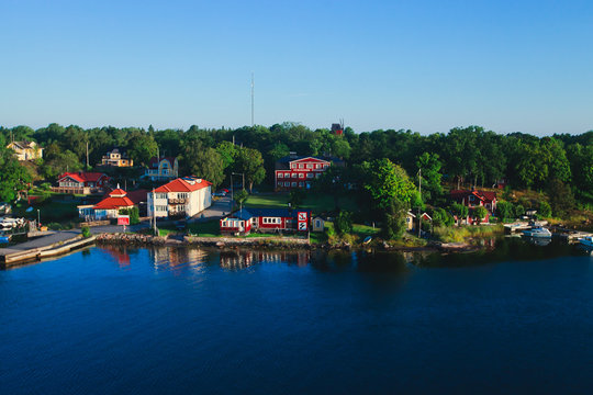Beautiful super wide-angle panoramic aerial view of Stockholm archipelago, Sweden with harbor and skyline with scenery beyond the city, seen from the ferry, sunny summer day with blue sky