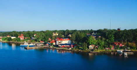 Fototapeta na wymiar Beautiful super wide-angle panoramic aerial view of Stockholm archipelago, Sweden with harbor and skyline with scenery beyond the city, seen from the ferry, sunny summer day with blue sky