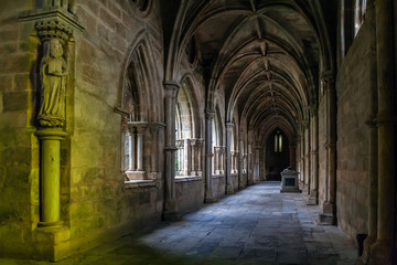 Evora, Portugal - December, 2015: Statue of a Saint placed on the cloister of the Evora Cathedral, the largest cathedral in Portugal. Romanesque and Gothic architecture. UNESCO World Heritage Site.
