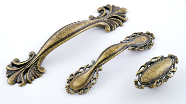 Classic Bronze set of furniture handles antique white background