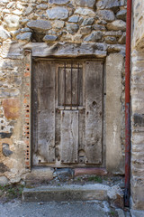 Fototapeta na wymiar Old wooden door in Spanish village