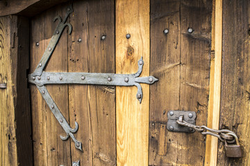 Old wooden door and padlock
