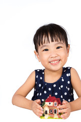 Asian Little Chinese Girl Holding Toy House for Property Concept